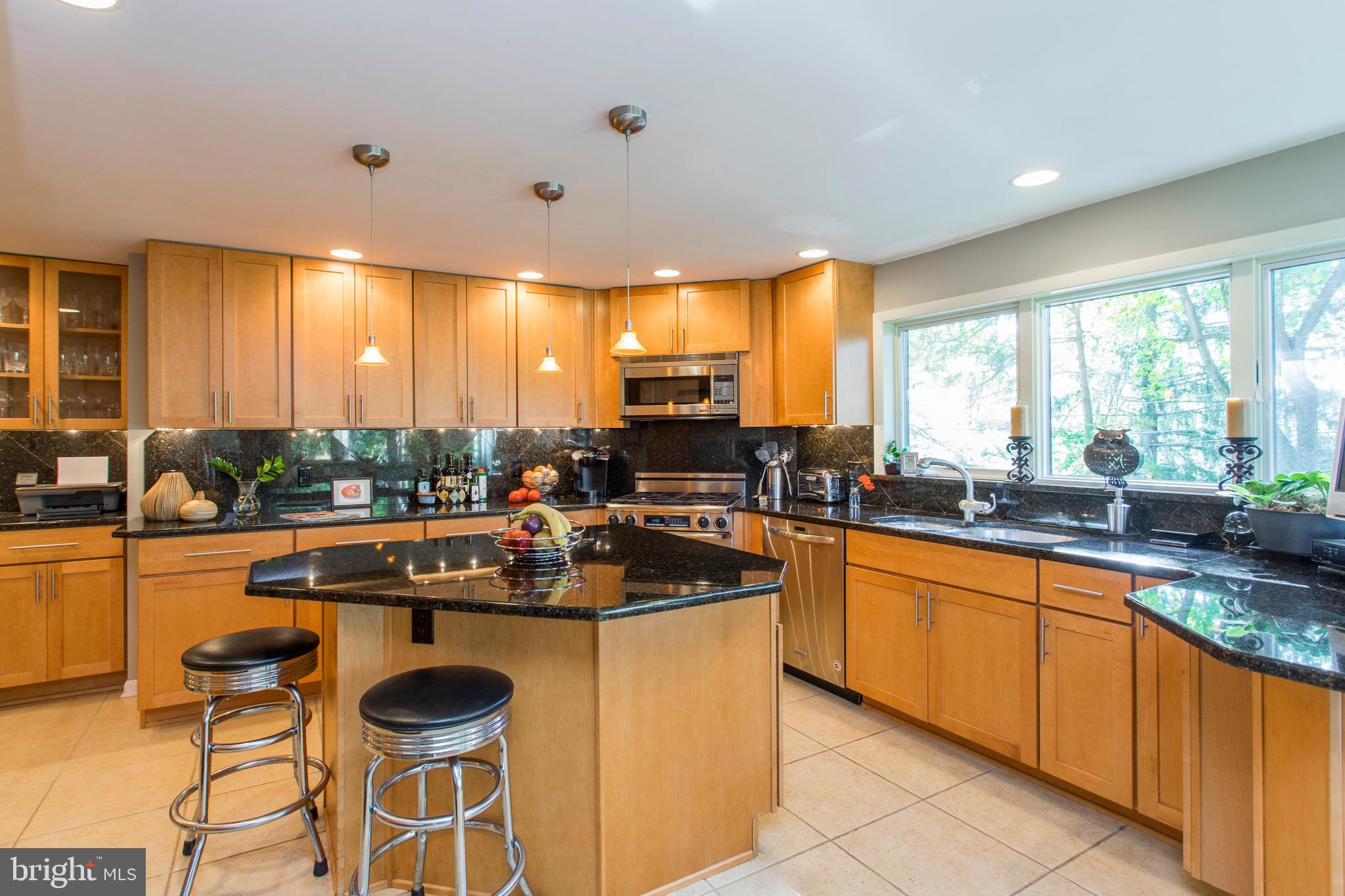 651 Church Road Flourtown, PA 19031 - Photo 9 of 29 Kitchen has granite countertops and island.