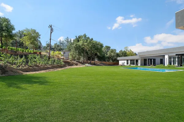 a view of house with garden