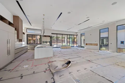 a large white room with lots of white furniture