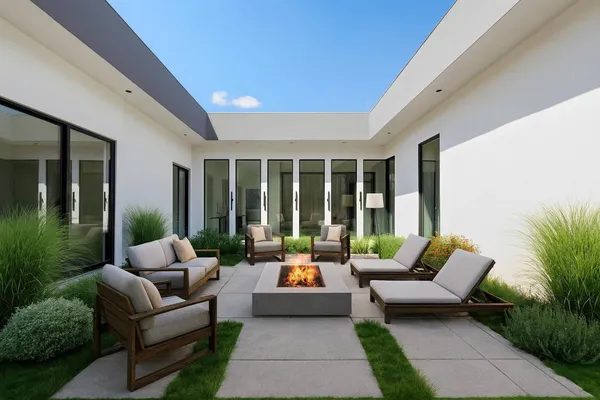 a balcony with furniture and a potted plant