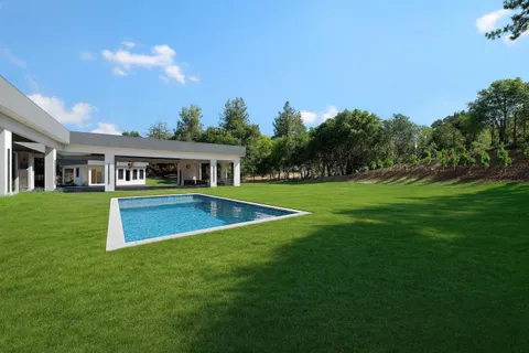 a view of a house with a swimming pool