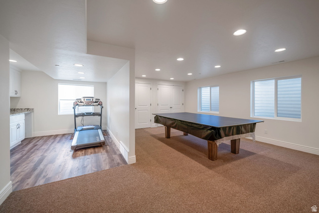 1288 North Horizon View Loop Elk Ridge, UT 84651 - Photo 31 of 40 Rec room with dark carpet, recessed lighting, and dark wood-style floors