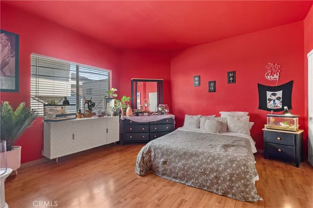 a bed room with a bed and a dresser