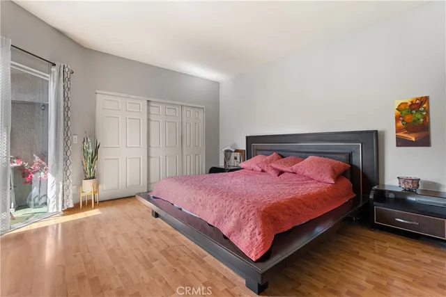 a bedroom with a bed and a cabinets