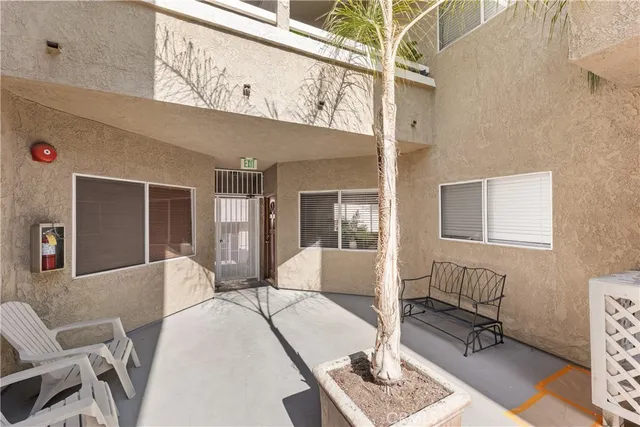 a view of a livingroom with furniture and windows