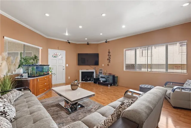 a living room with furniture fireplace and a flat screen tv