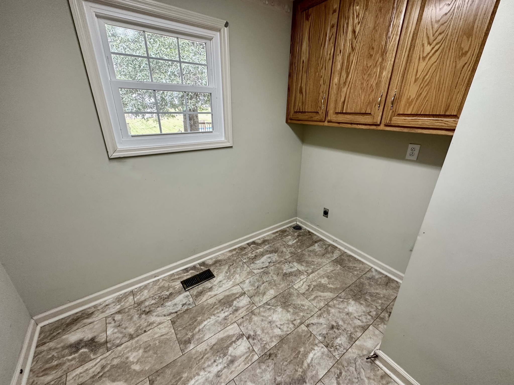 654 Denning Ford Road Portland, TN 37148 - Photo 21 of 39 a view of a room with wooden floor and cabinet