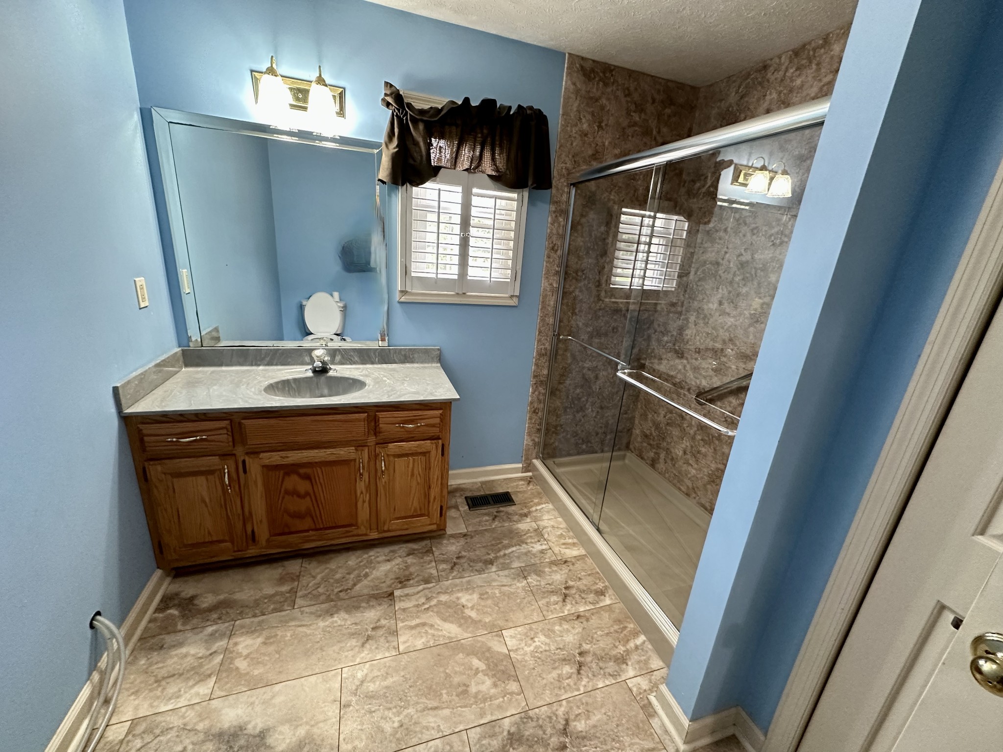 654 Denning Ford Road Portland, TN 37148 - Photo 10 of 39 a bathroom with a sink and mirror