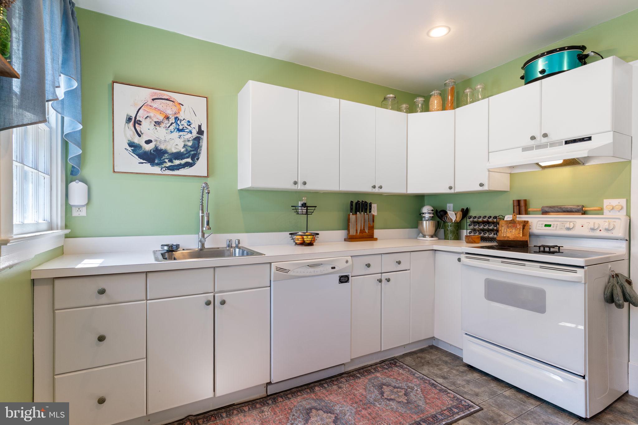 2844 Ridge Road Huntingtown, MD 20639 - Photo 11 of 47 a kitchen with cabinets appliances and a sink