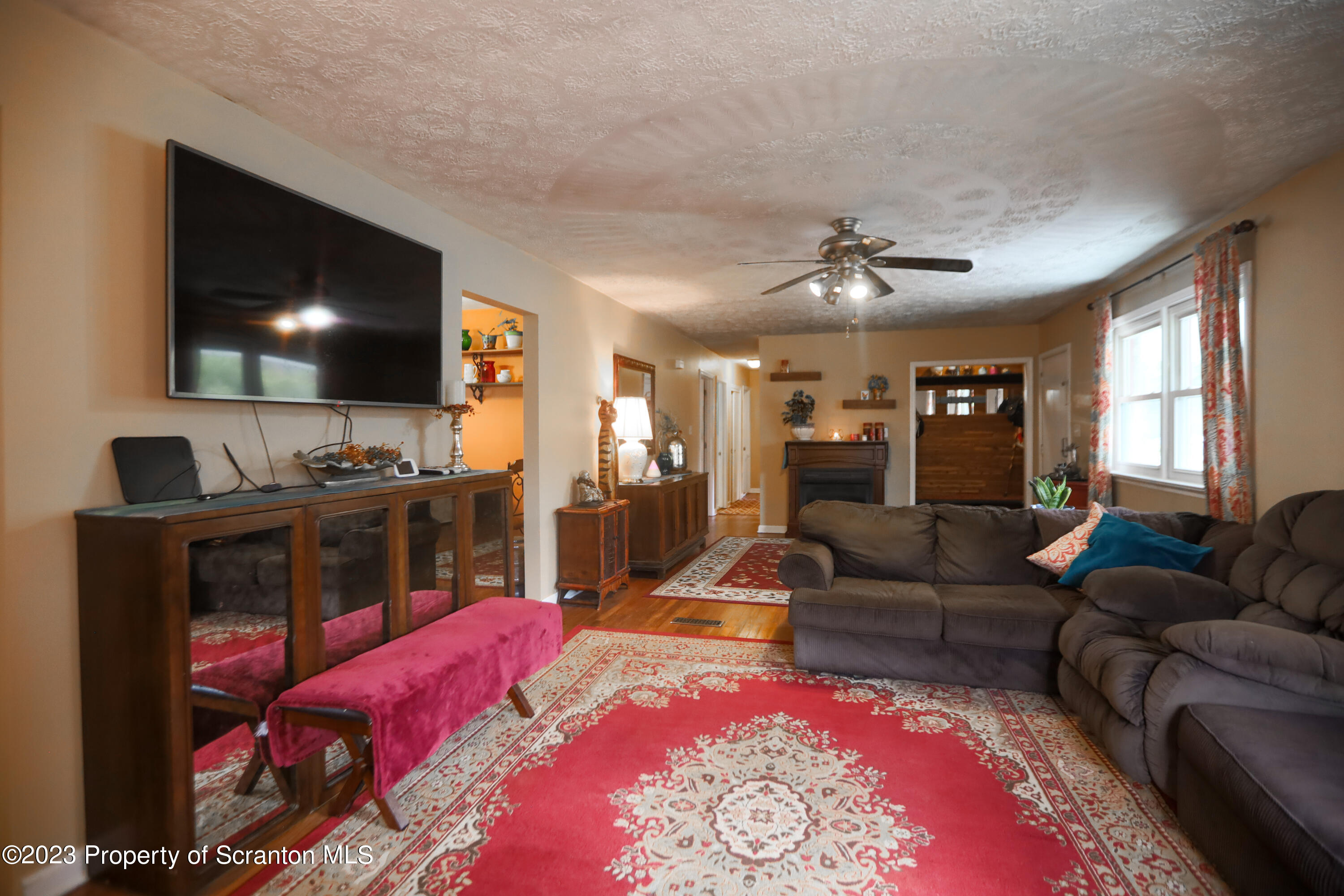 740 Weavertown Road Shavertown, PA 18708 - Photo 23 of 82 a living room with furniture a flat screen tv and kitchen view