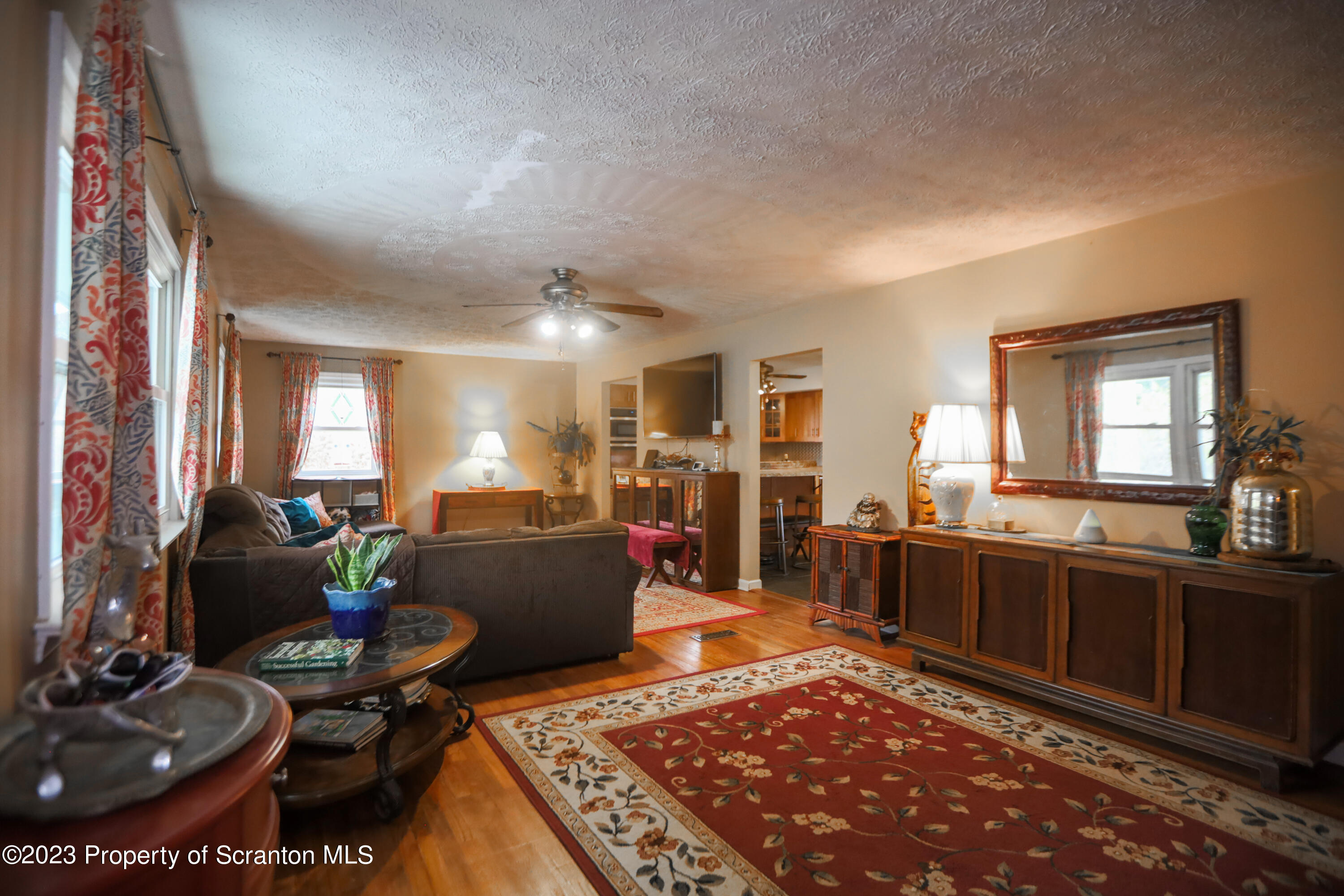 740 Weavertown Road Shavertown, PA 18708 - Photo 24 of 82 a living room with furniture a rug kitchen view and a large window
