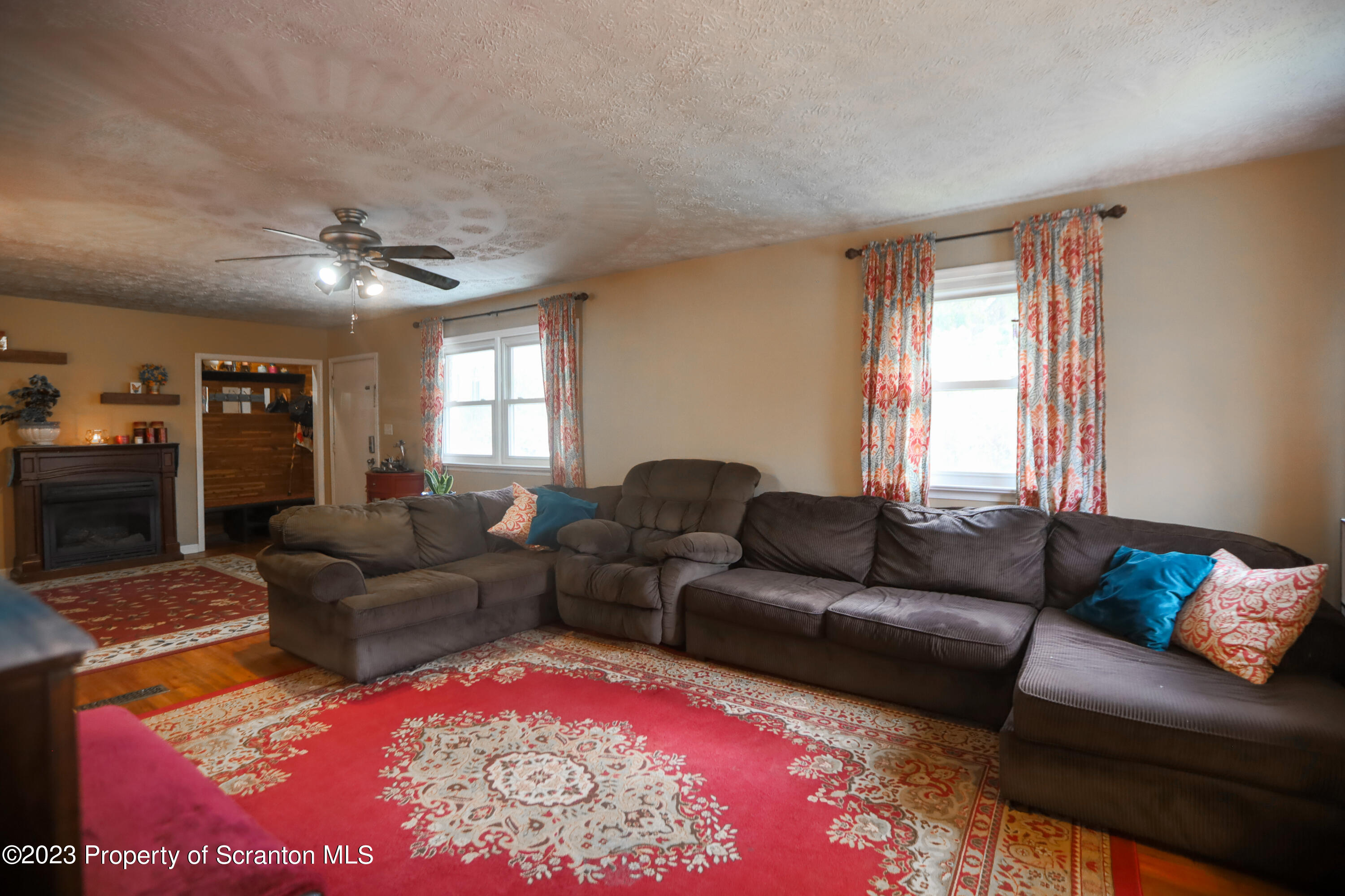 740 Weavertown Road Shavertown, PA 18708 - Photo 25 of 82 a living room with furniture and a chandelier