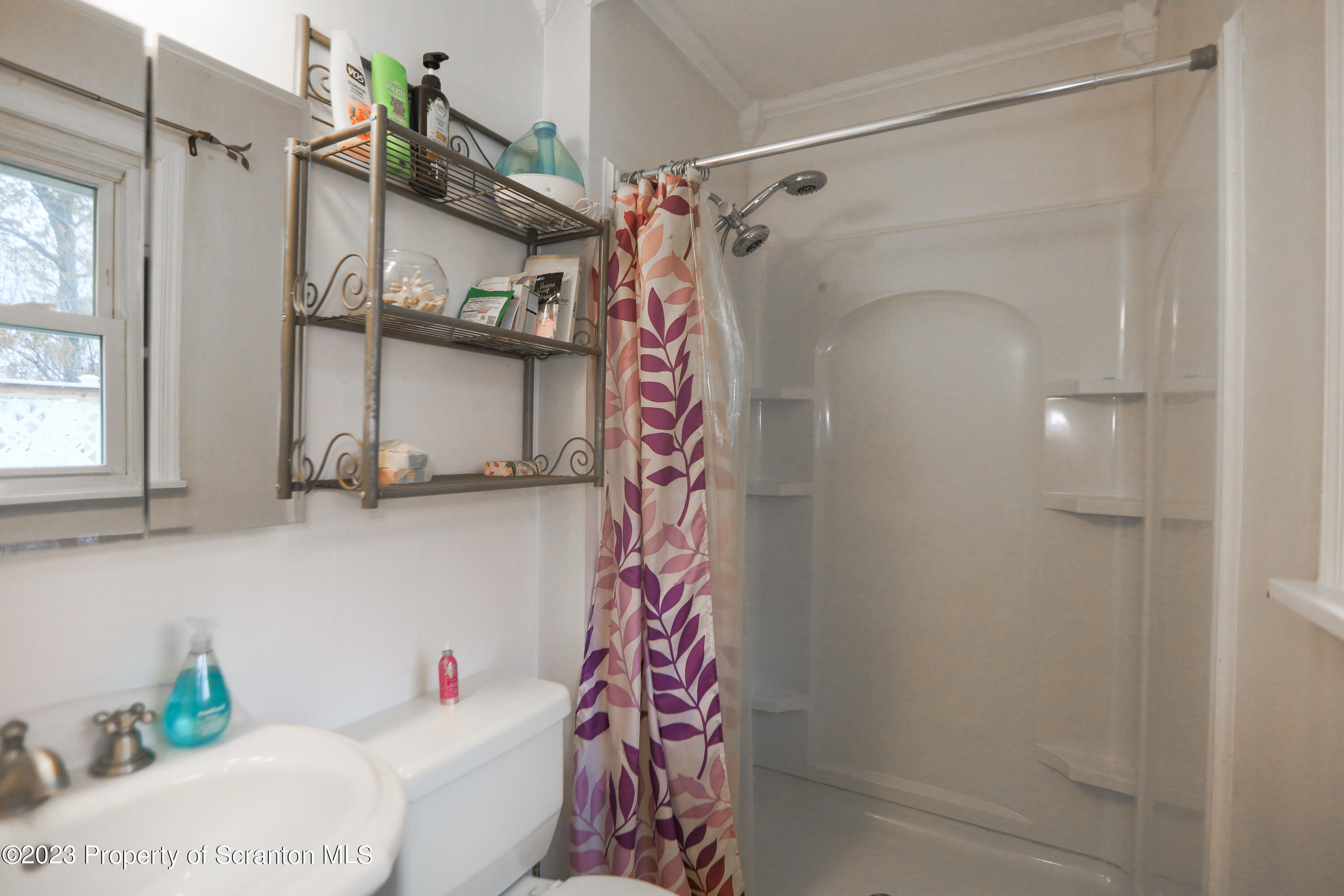 740 Weavertown Road Shavertown, PA 18708 - Photo 39 of 82 a bathroom with a shower curtain and a window