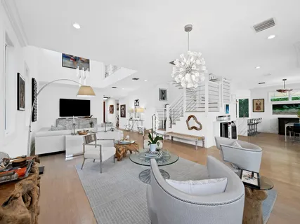 a kitchen with stainless steel appliances kitchen island granite countertop a stove and a sink