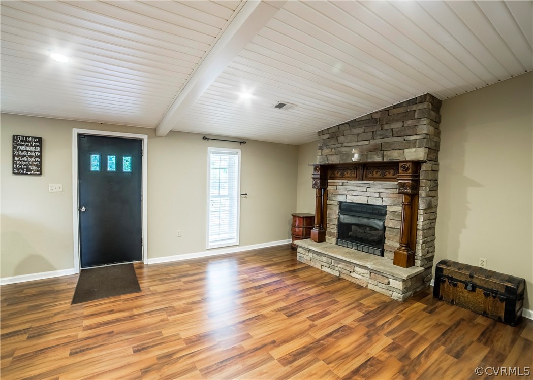 2518 Howardsville Road Buckingham, VA 23921 - Photo 20 of 41 an empty room with wooden floor fireplace and windows