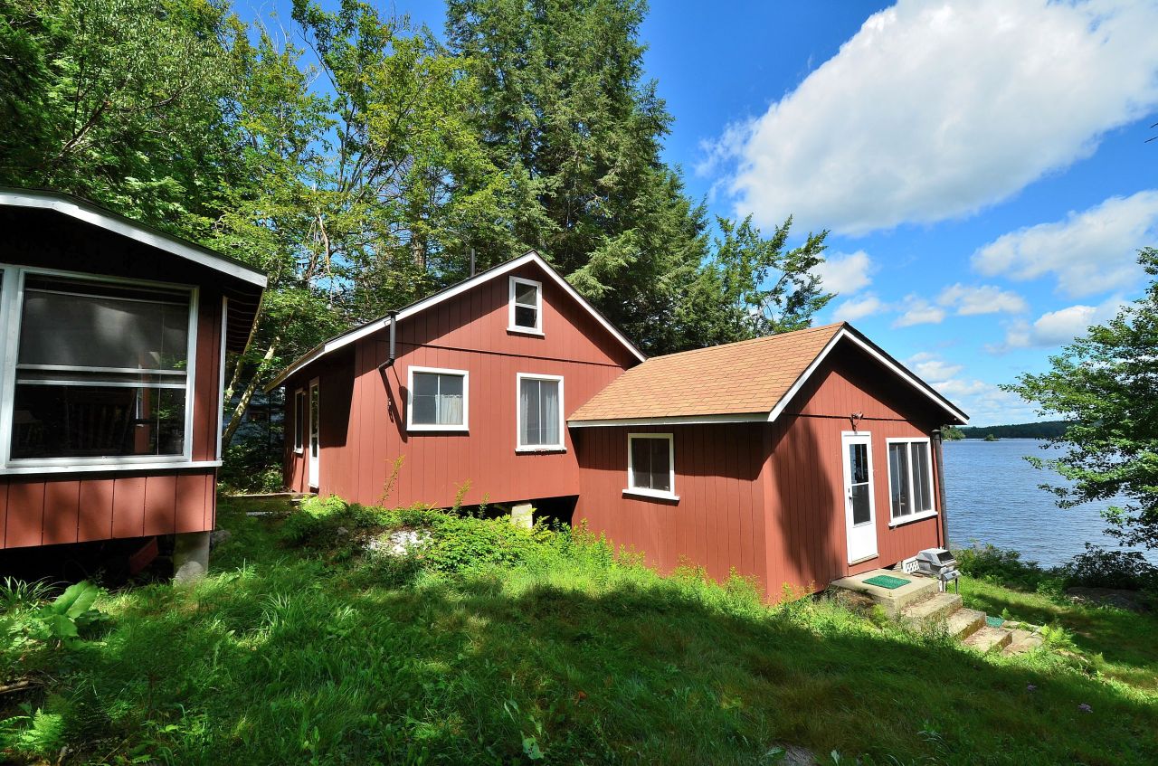 405 Stanley Road Otis, MA 01029 - Photo 2 of 16 a front view of a house with a yard