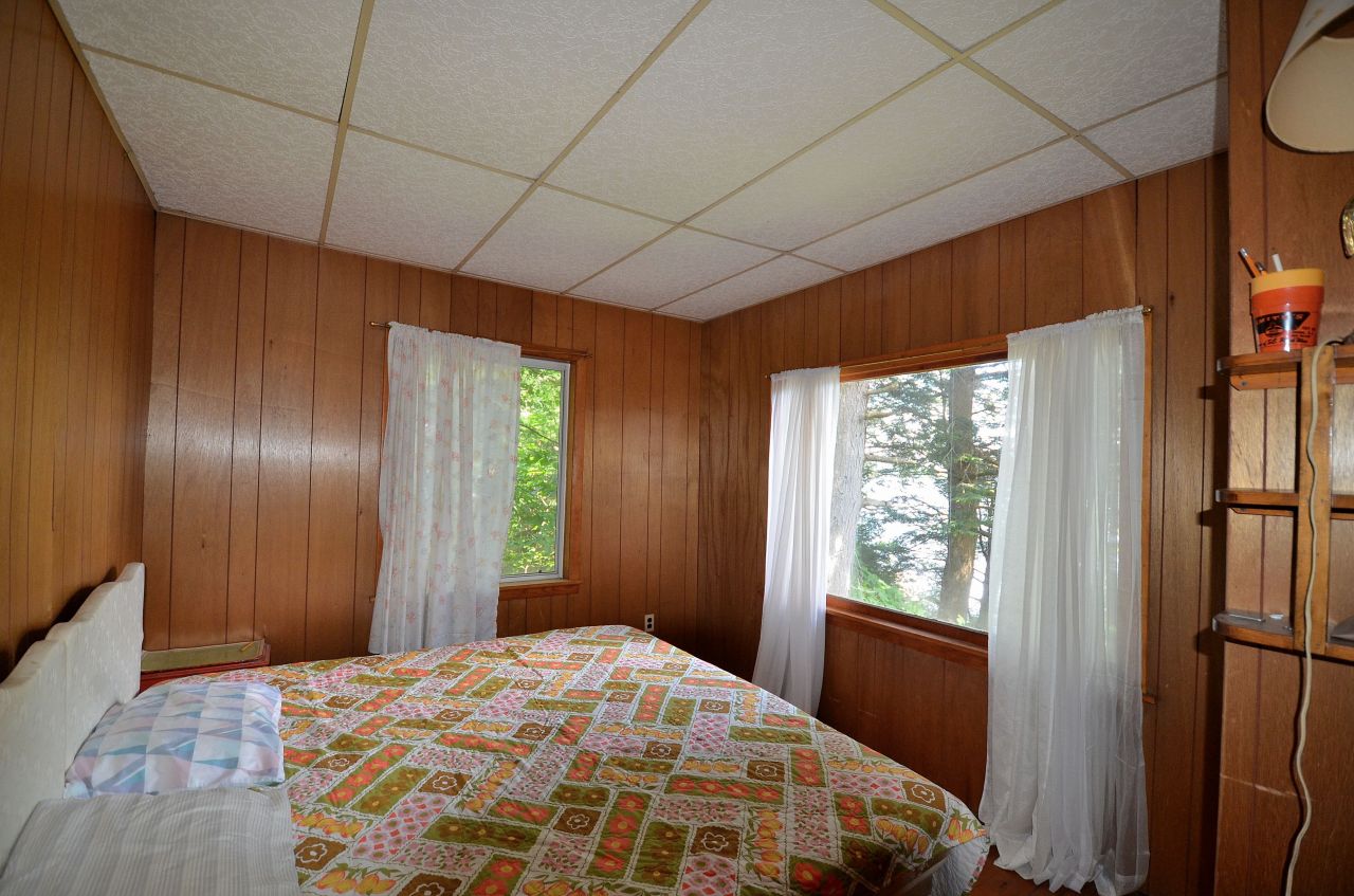 405 Stanley Road Otis, MA 01029 - Photo 12 of 16 a bedroom with a bed and a window