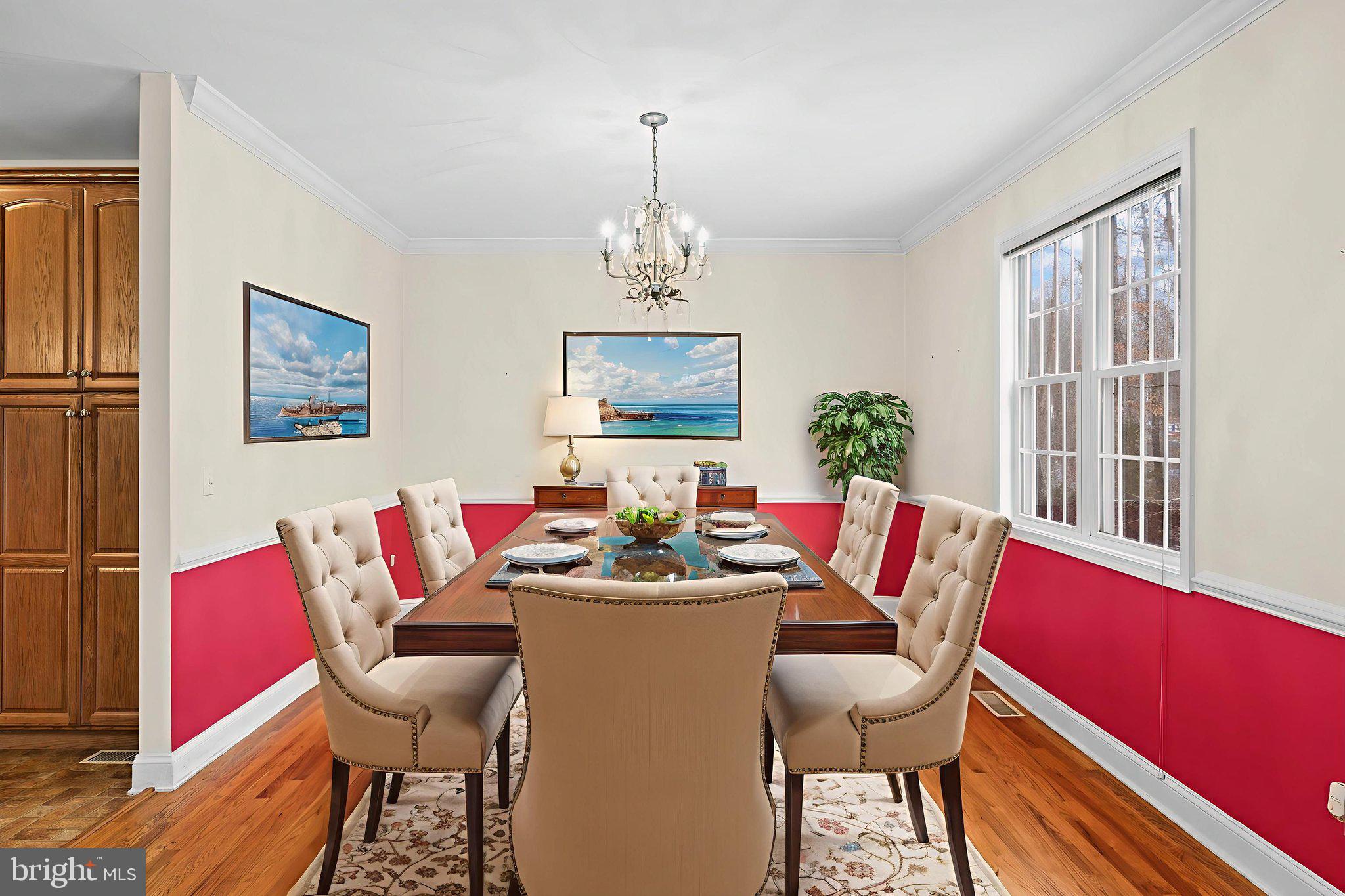 2481 Yanceyville Road Louisa, VA 23093 - Photo 12 of 66 a view of a dining room with furniture window and wooden floor