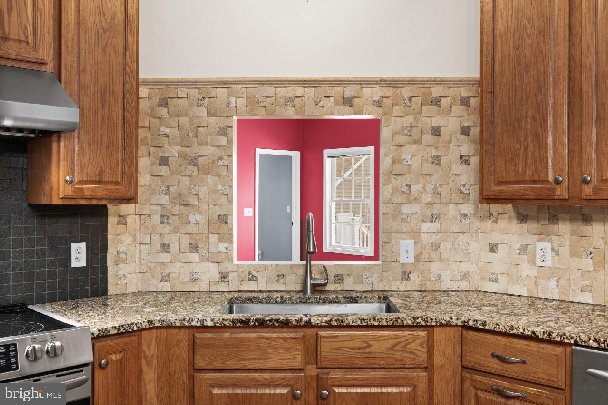 2481 Yanceyville Road Louisa, VA 23093 - Photo 20 of 66 a kitchen with granite countertop a sink and a stove