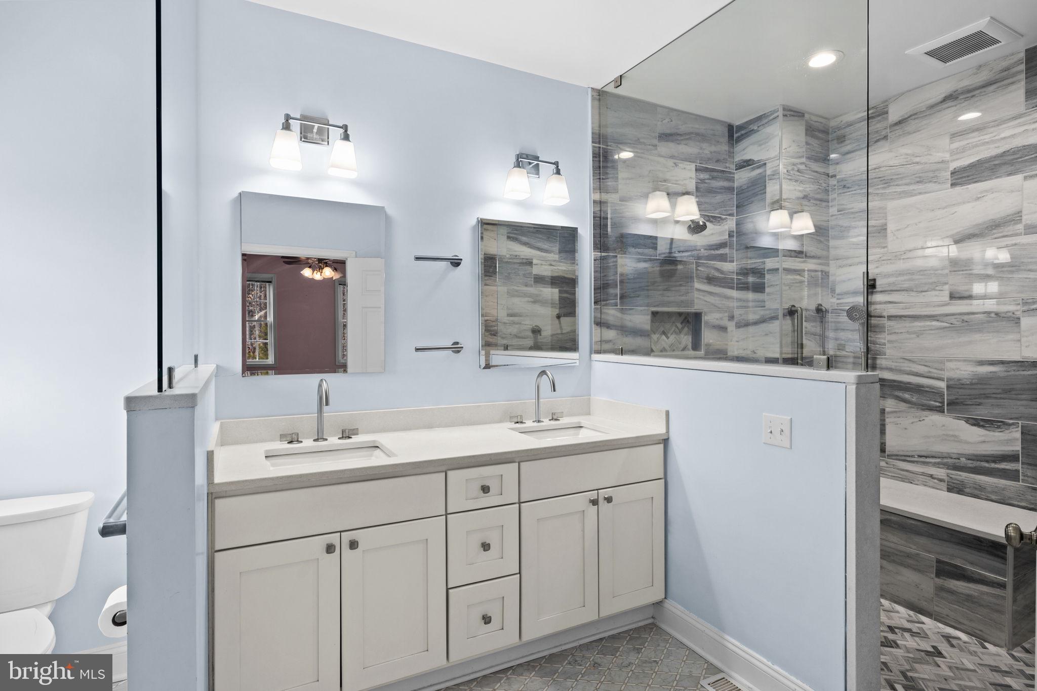 2481 Yanceyville Road Louisa, VA 23093 - Photo 25 of 66 a bathroom with a double vanity sink mirror and shower