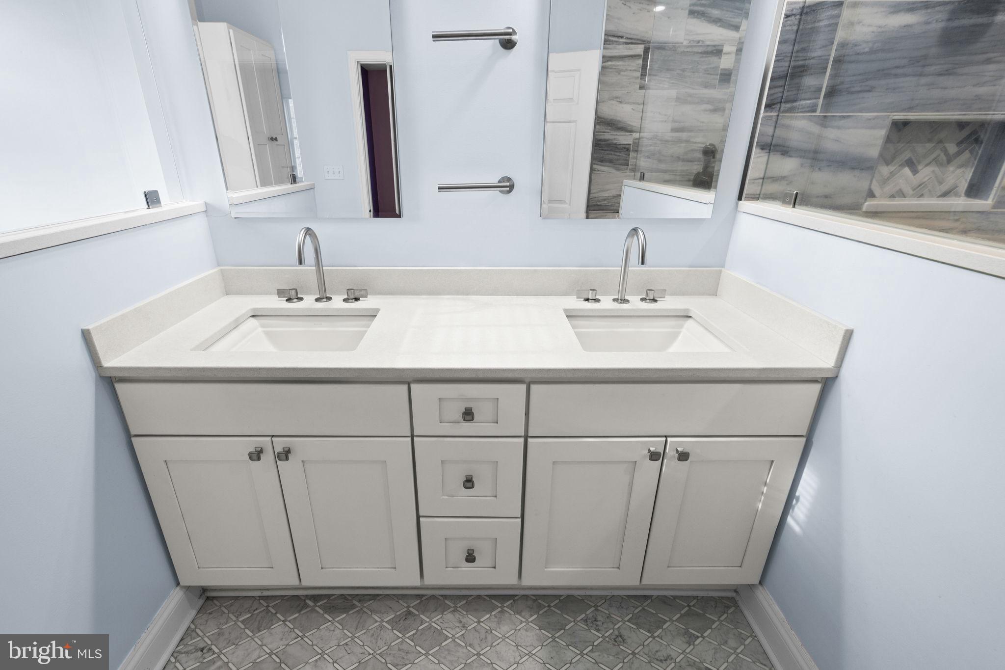 2481 Yanceyville Road Louisa, VA 23093 - Photo 28 of 66 a bathroom with a sink and a mirror