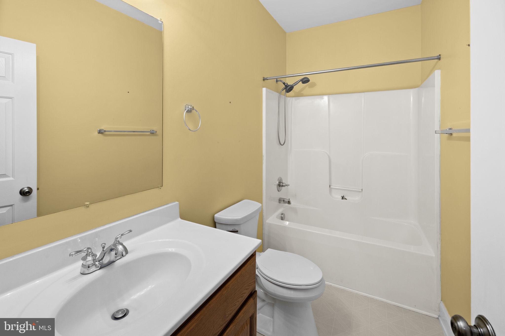 2481 Yanceyville Road Louisa, VA 23093 - Photo 30 of 66 a bathroom with a sink a toilet and shower