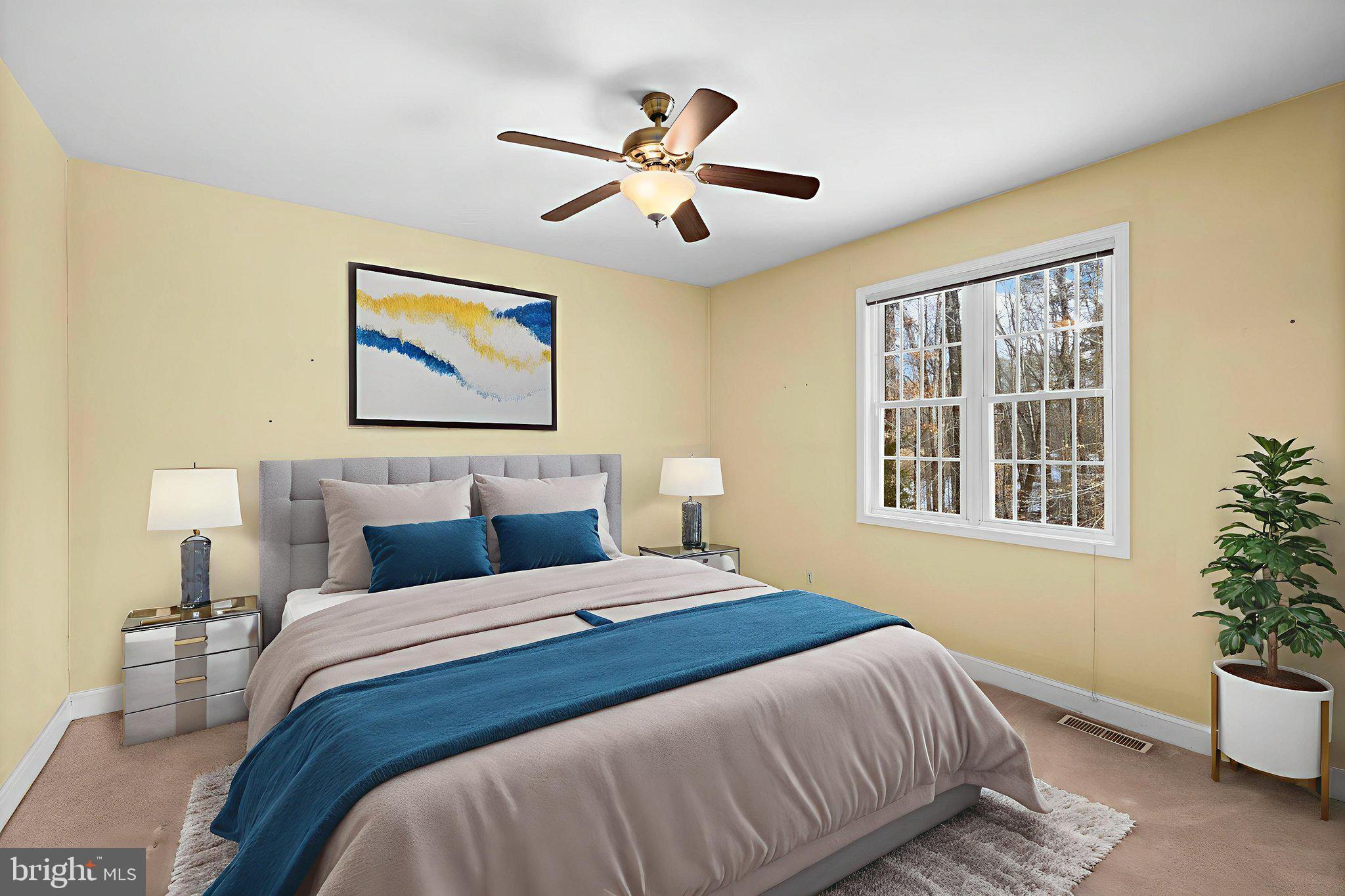 2481 Yanceyville Road Louisa, VA 23093 - Photo 31 of 66 a bedroom with a bed and a large window