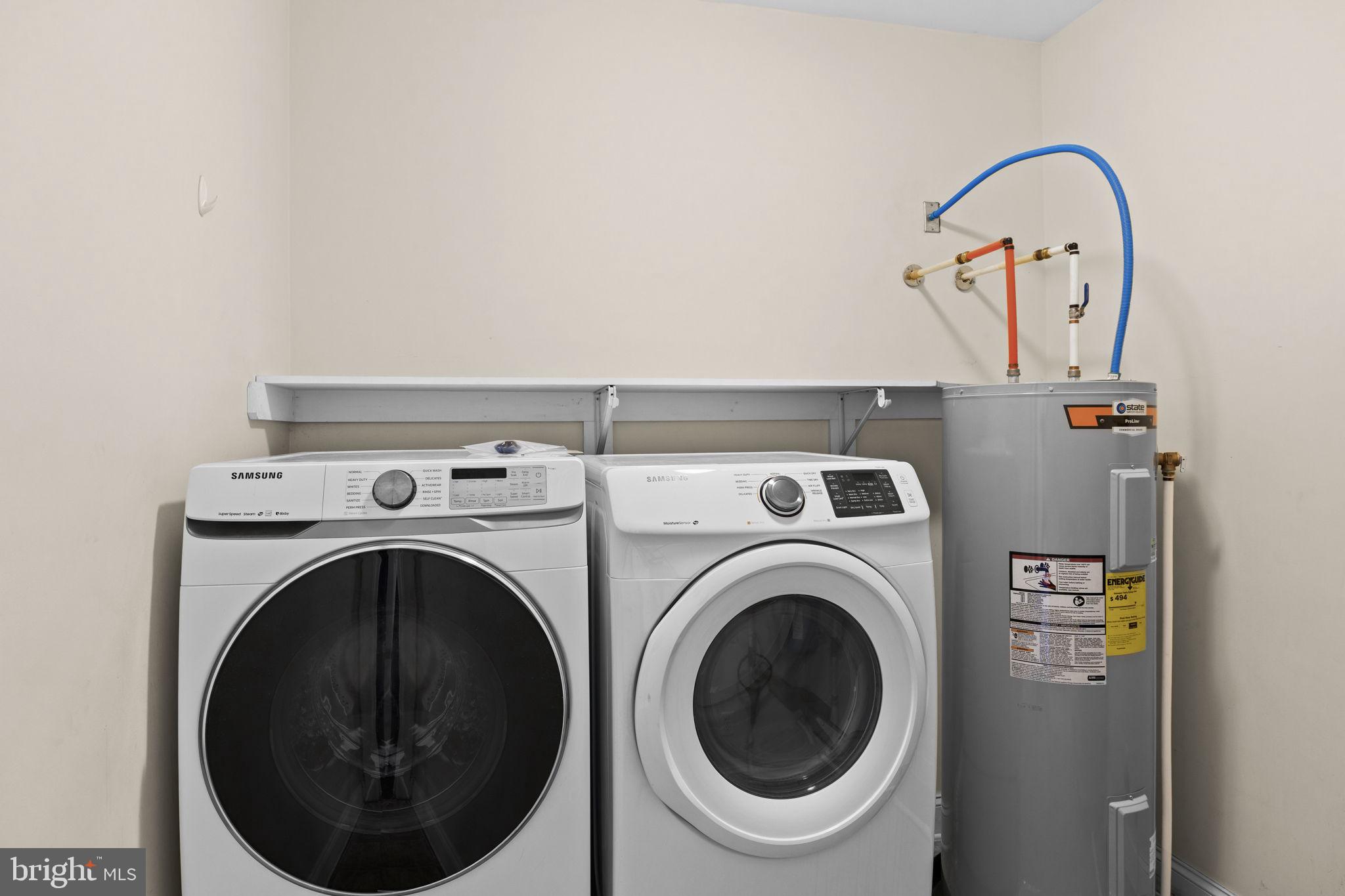 2481 Yanceyville Road Louisa, VA 23093 - Photo 35 of 66 a close view of a utility room with dryer and washer