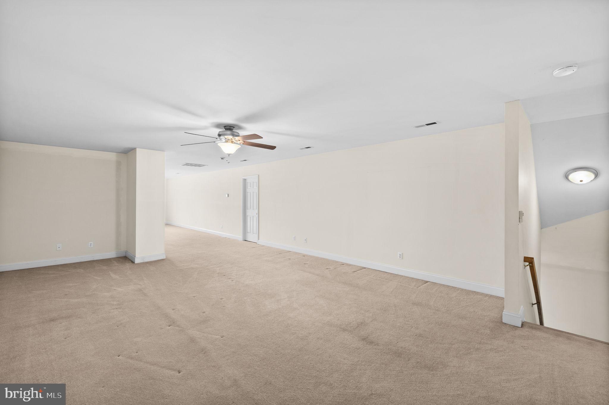 2481 Yanceyville Road Louisa, VA 23093 - Photo 39 of 66 a view of a livingroom with a ceiling fan and entryway