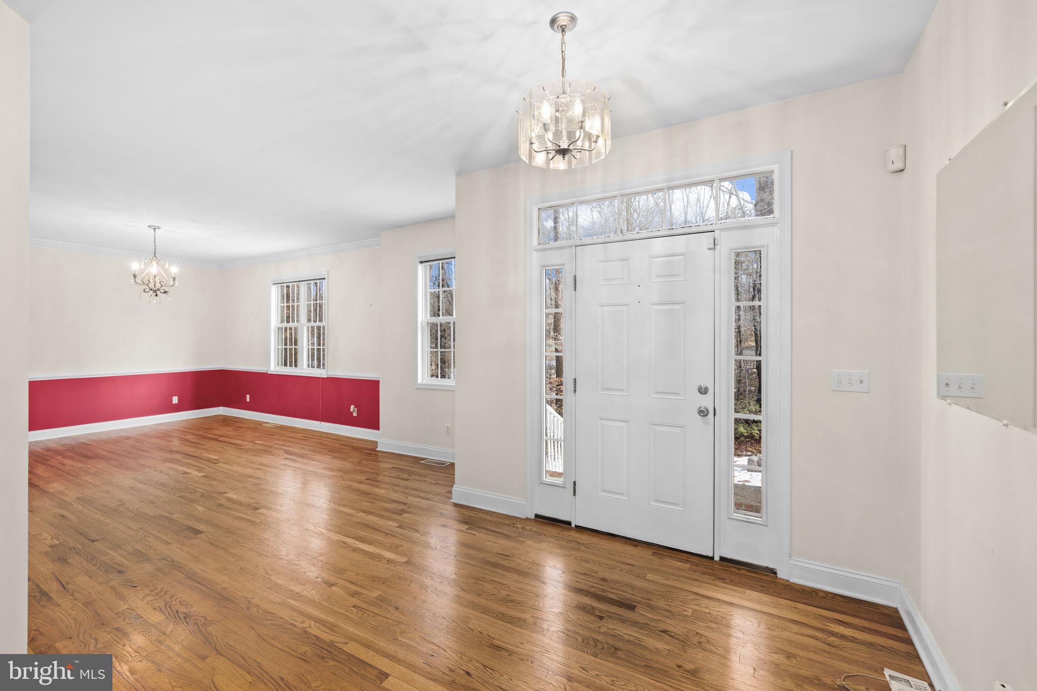 2481 Yanceyville Road Louisa, VA 23093 - Photo 4 of 66 a view of empty room with wooden floor and fan
