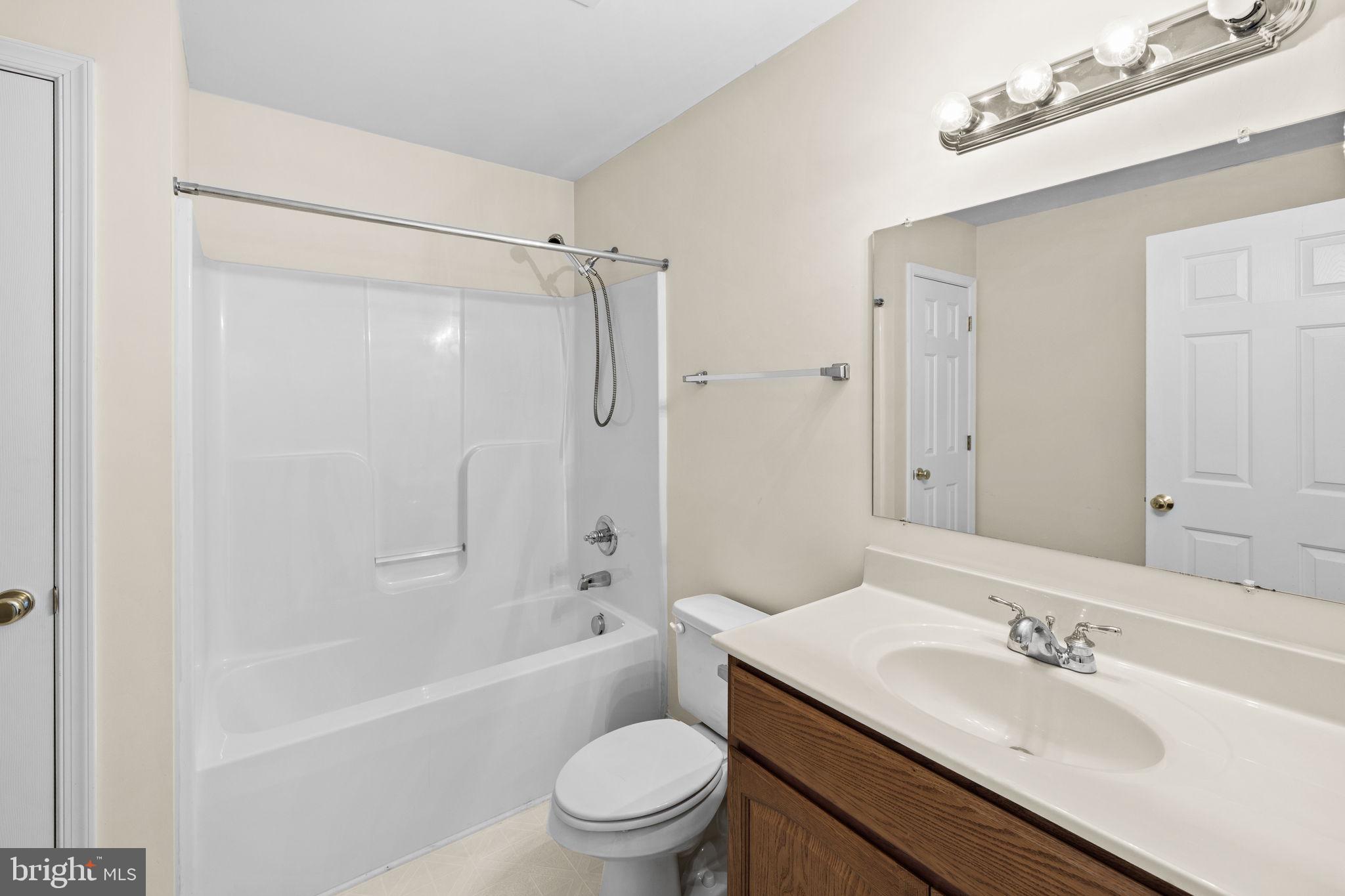 2481 Yanceyville Road Louisa, VA 23093 - Photo 42 of 66 a bathroom with a sink a toilet and shower