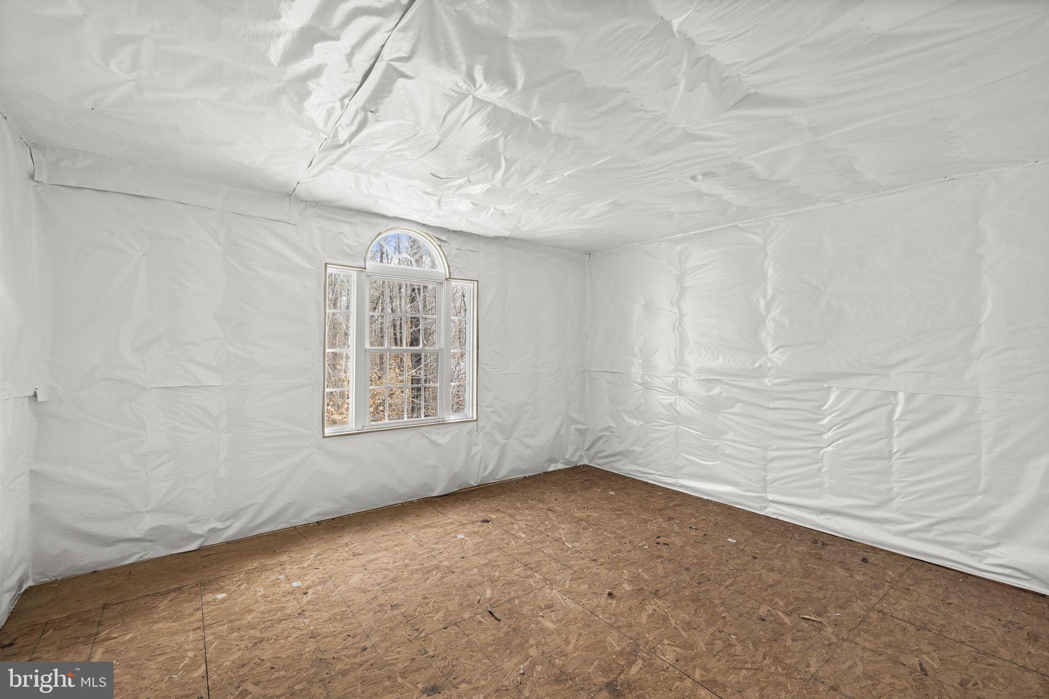 2481 Yanceyville Road Louisa, VA 23093 - Photo 47 of 66 a view of an empty room with a window