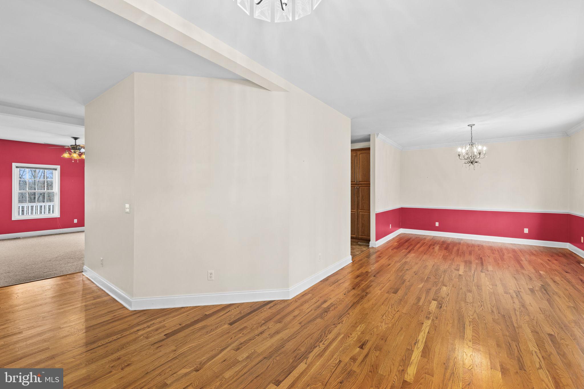 2481 Yanceyville Road Louisa, VA 23093 - Photo 5 of 66 a view of a room with wooden floor and windows
