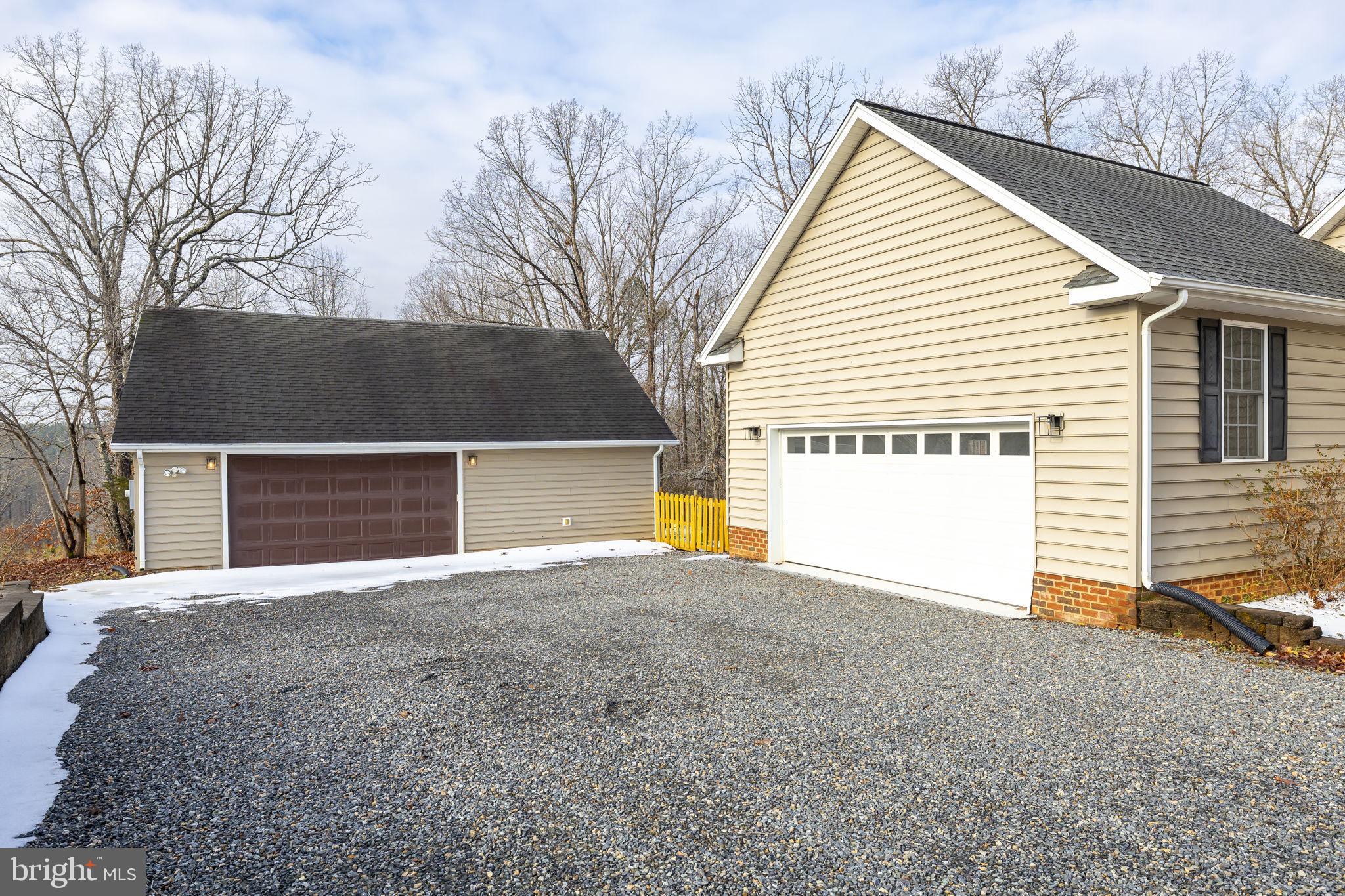 2481 Yanceyville Road Louisa, VA 23093 - Photo 52 of 66 a view of a house with a yard and garage