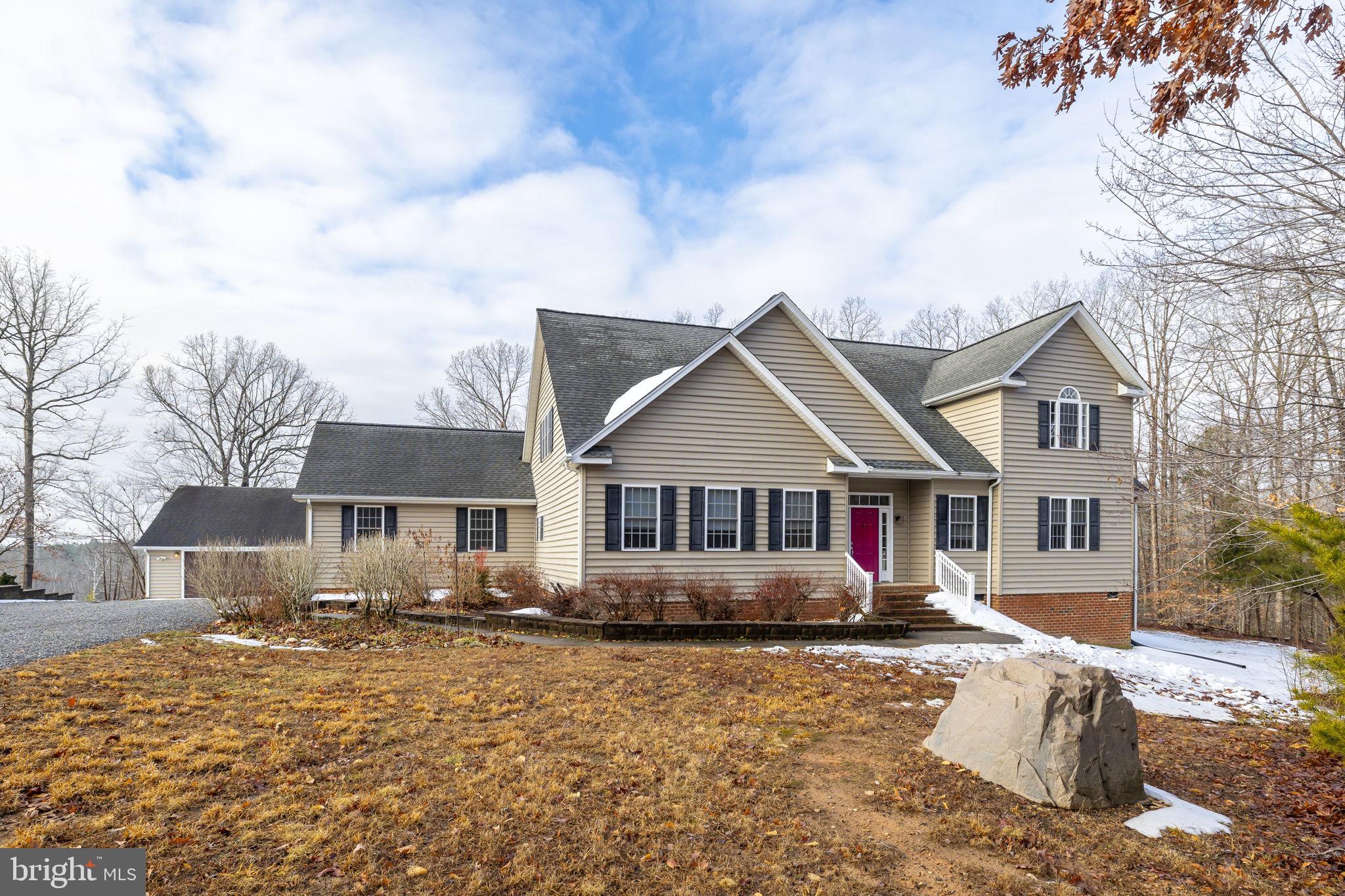 2481 Yanceyville Road Louisa, VA 23093 - Photo 66 of 66 a front view of a house with a yard covered in snow
