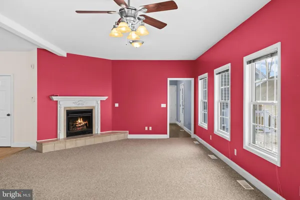 a living room with a fireplace