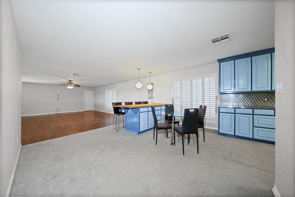 891 HCR 2124 Loop Whitney, TX 76692 - Photo 18 of 40 a open kitchen with cabinets table and chairs
