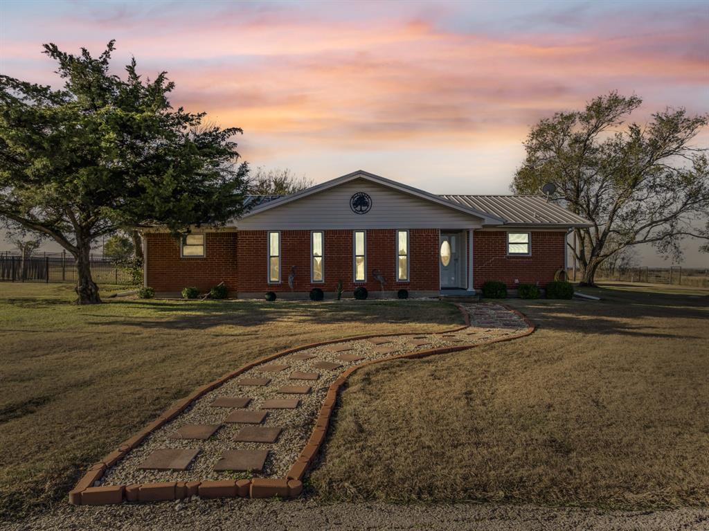 891 HCR 2124 Loop Whitney, TX 76692 - Photo 2 of 40 a front view of a house with a yard
