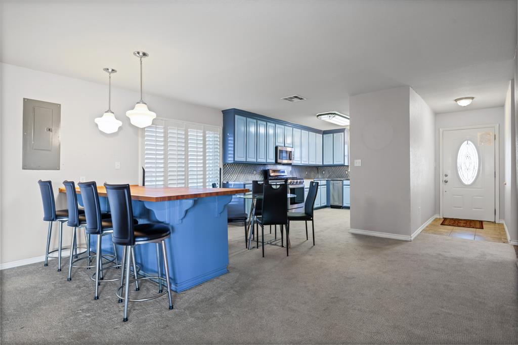 891 HCR 2124 Loop Whitney, TX 76692 - Photo 22 of 40 a view of a dining room with furniture and chandelier