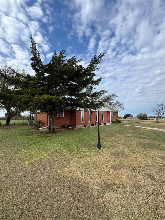 891 HCR 2124 Loop Whitney, TX 76692 - Photo 39 of 40 a view of a house with a yard