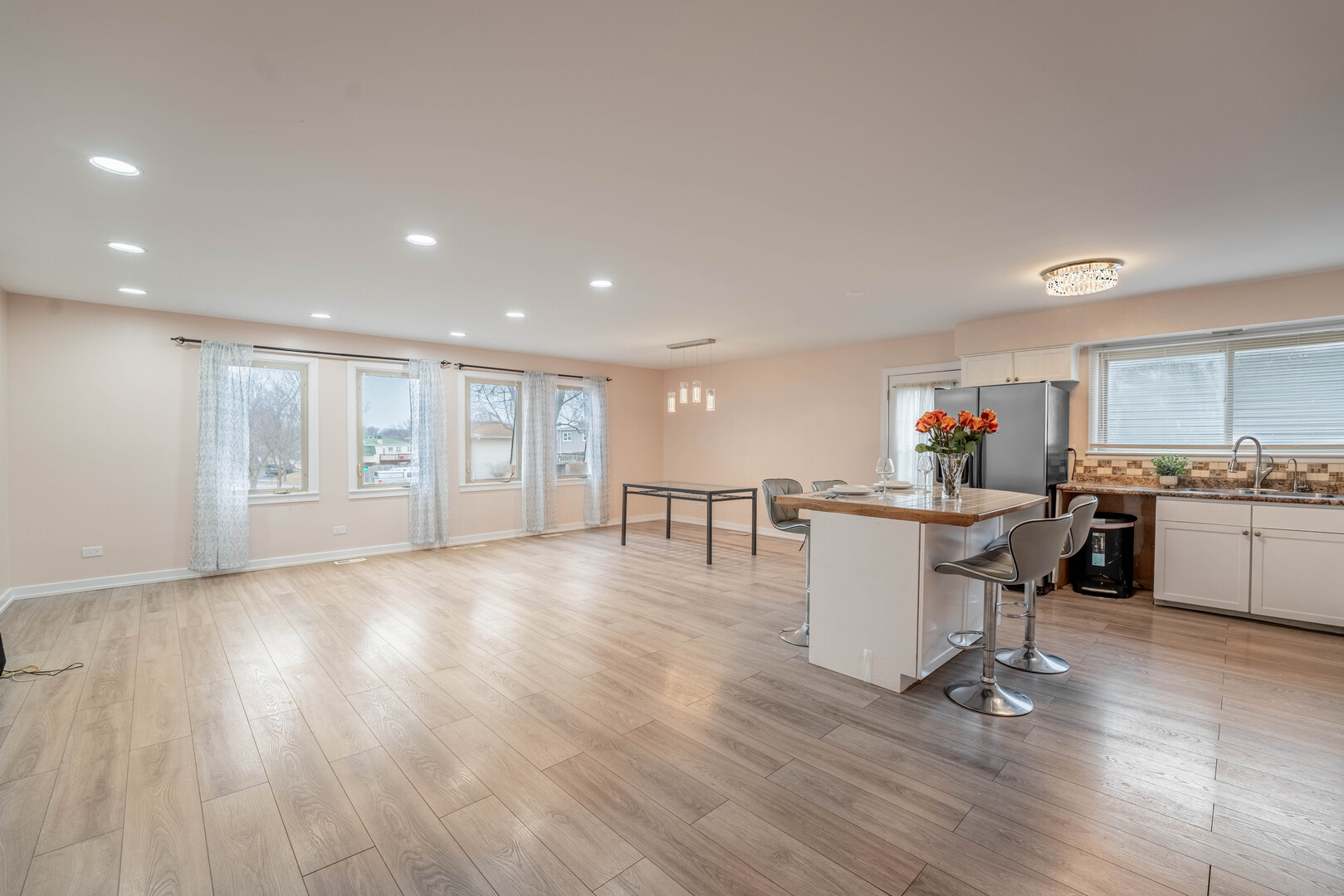 309 Falconridge Way Bolingbrook, IL 60440 - Photo 8 of 34 a kitchen with a sink cabinets and wooden floor