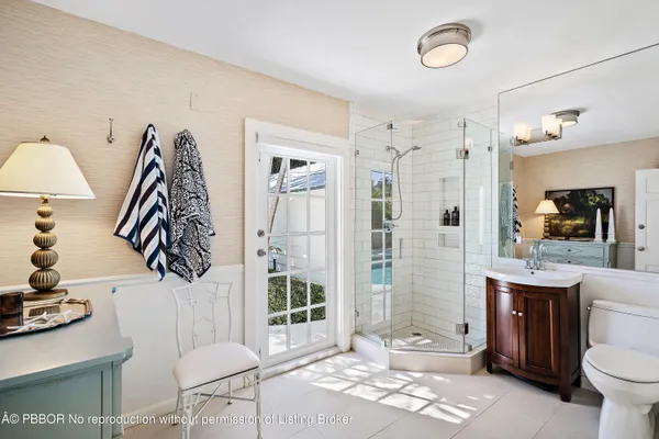 a bathroom with a toilet sink and shower