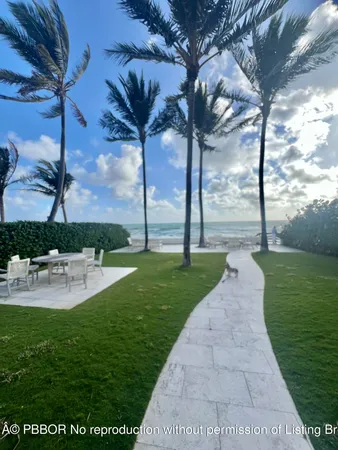 a view of a patio with a table and chairs