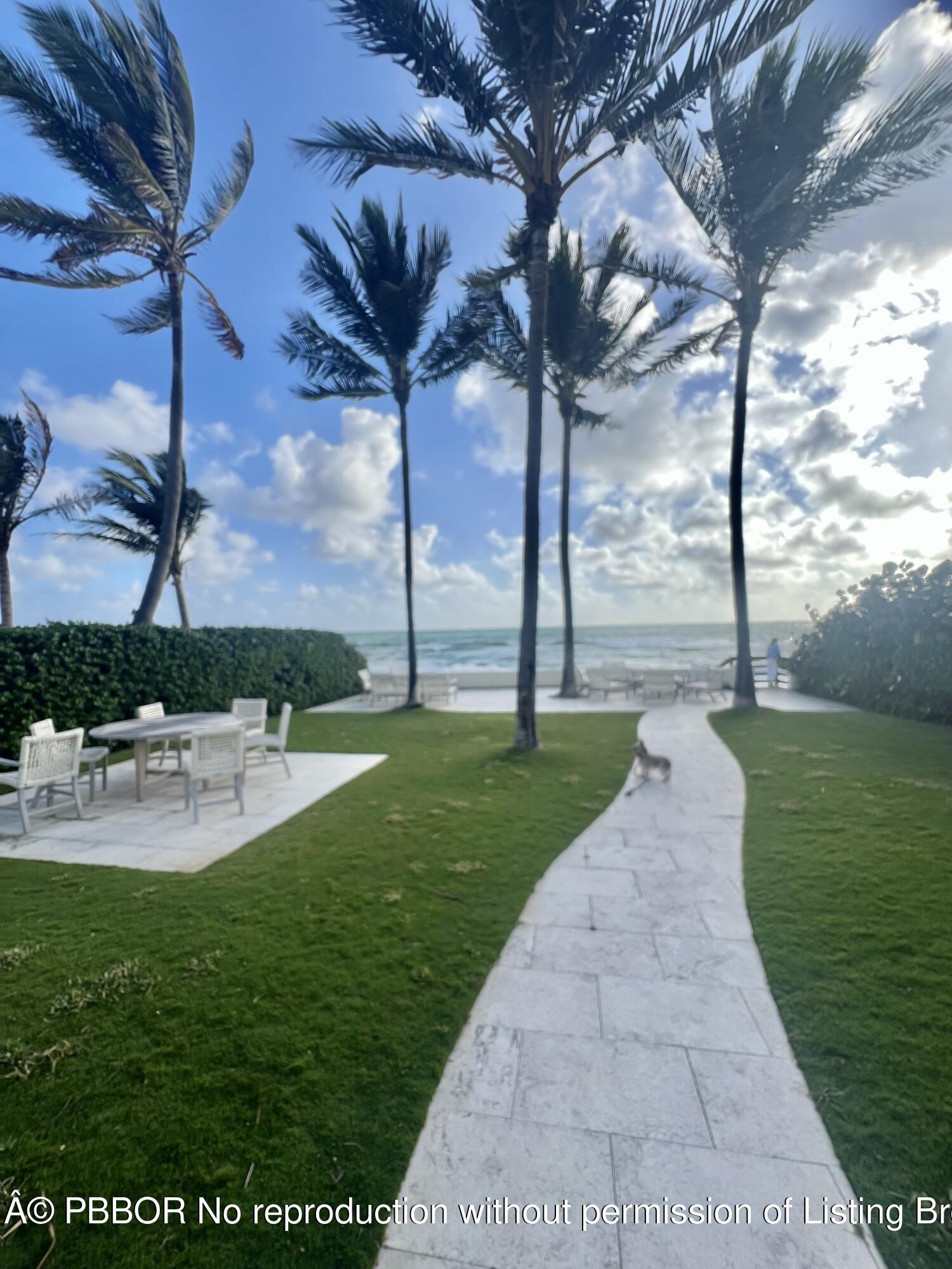 230 Colonial Lane Palm Beach, FL 33480 - Photo 14 of 17 a view of a patio with a table and chairs