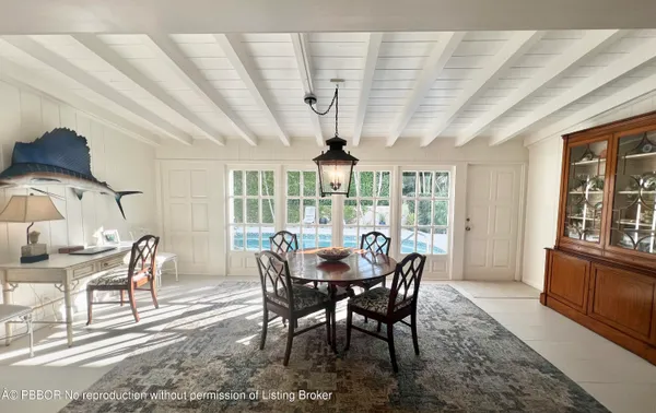 a view of a dining room with furniture window and outside view