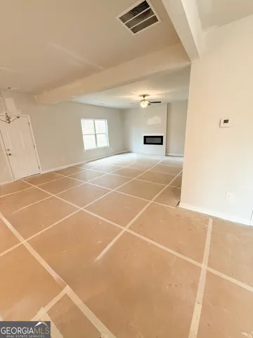 a room with gym equipment and a window