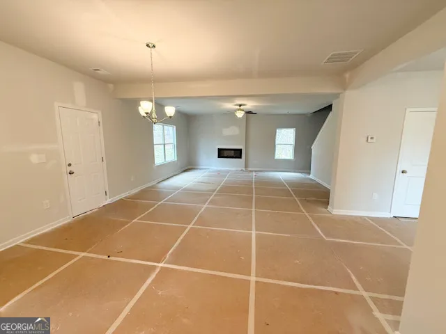 a room with gym equipment and a mirror