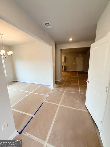 a room with gym equipment and a shower