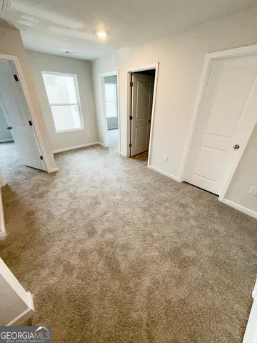 a view of an empty room with windows