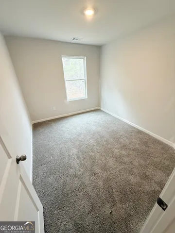 an empty room with a bench